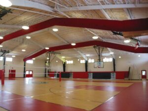 Gymnasium with roll out bleachers & scoreboard
